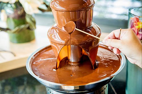 A chocolate melting machine is useful in preparing chocolate for fountains